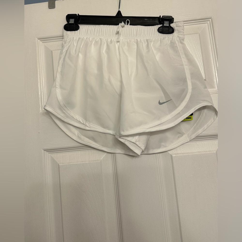 Nike standard Fit Women's White Shorts are a size XS.